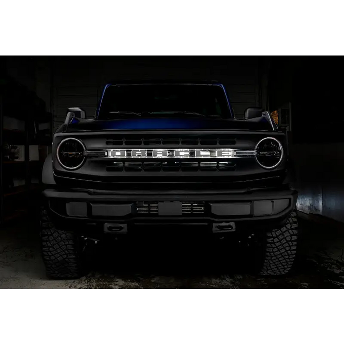 Matte black LED letter badge on a truck