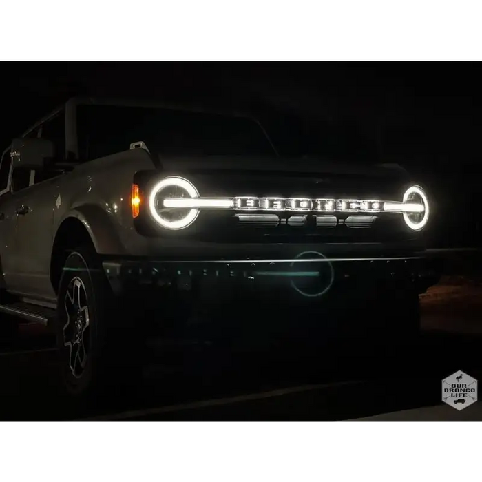 White truck with LED letter badges in ORACLE Lighting product - Matte Black Finish.