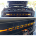 Matte black LED letter badges on front end of open hood black car.