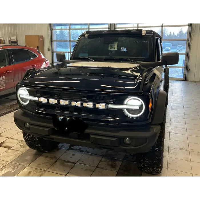 Black truck parked in garage showcasing ORACLE Lighting Universal Illuminated LED Letter Badges - Matte White Surface Finish - R.