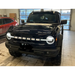 Black truck parked in garage showcasing ORACLE Lighting Universal Illuminated LED Letter Badges - Matte White Surface Finish - R.