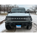 Grey lifted truck in snow, featuring ORACLE Lighting Universal Illuminated LED Letter Badges in Matte White - N.