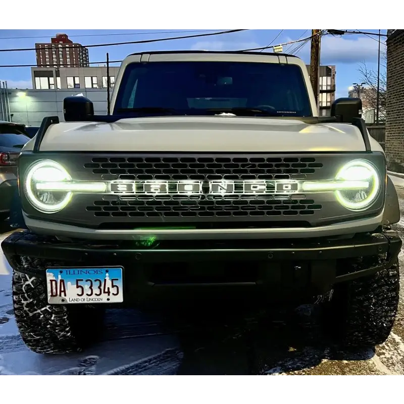 White truck with illuminated LED badge from ORACLE Lighting, featuring matte white surface finish - C.