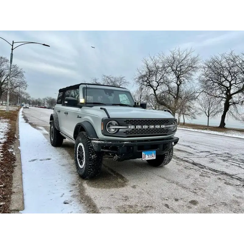Oracle Lighting Universal Illuminated LED Letter Badges on white Ford truck in snow