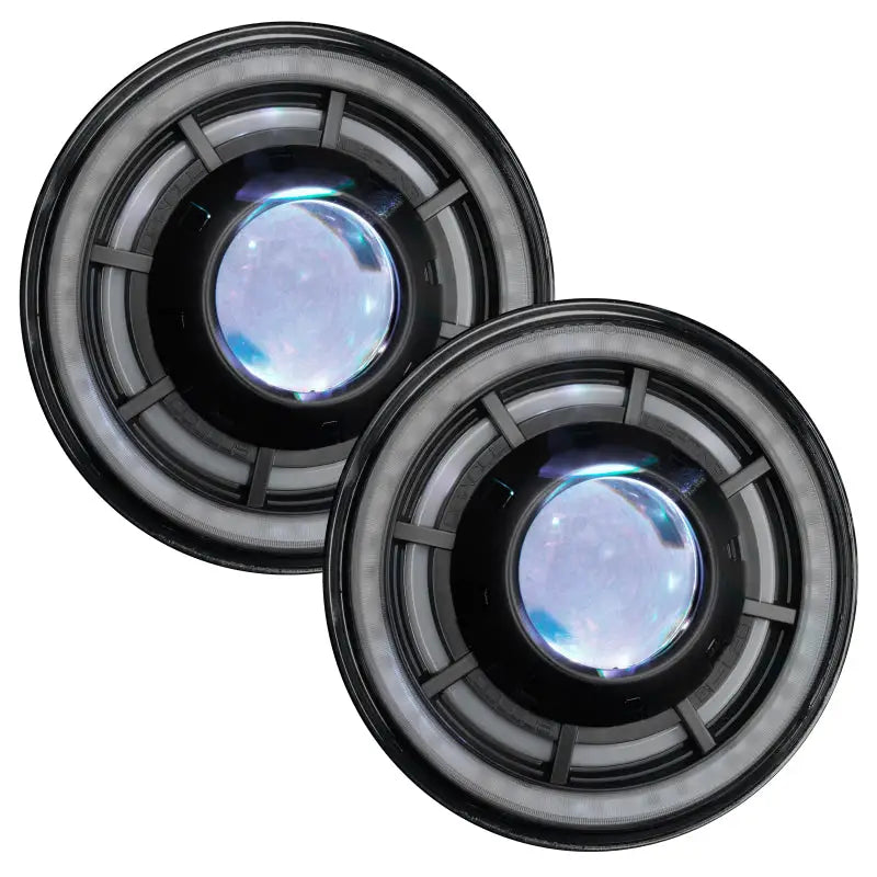 Two black speakers with blue lights on a white background.