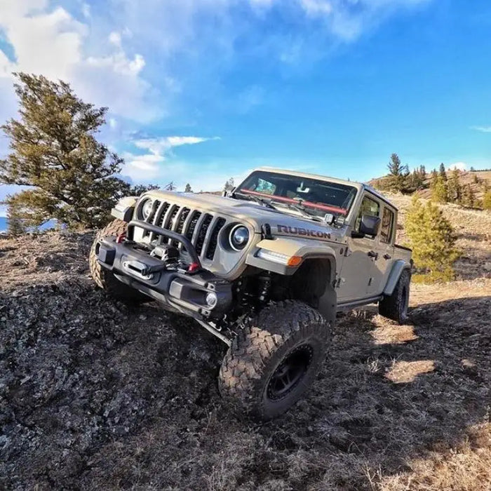 Jeep driving rocky terrain with Oracle Oculus Bi-LED Projector Headlights for Jeep JL/Gladiator JT