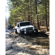 Jeep stuck in mud with Oracle Oculus Bi-LED projector headlights for Jeep JL Gladiator.