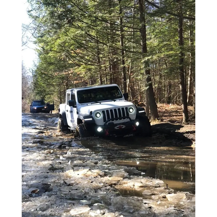 Jeep stuck in mud with Oracle Oculus Bi-LED projector headlights for Jeep JL Gladiator.