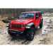 Red Jeep driving through mud with Oracle Oculus Bi-LED projector headlights for Jeep JL/Gladiator JT