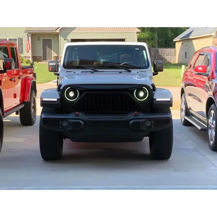 Two Jeeps parked in driveway with Oracle Oculus Bi-LED Projector Headlights for Jeep JL/Gladiator JT - Matte Black