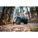 Close-up of Jeep parked in woods on dirt road with Oracle Oculus Bi-LED Projector Headlights for Jeep JL/Gladiator JT - Matte Black - 550