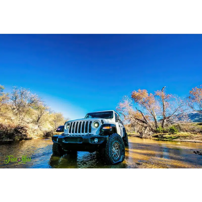 Oracle Oculus Bi-LED Projector Headlights for Jeep JL/Gladiator JT - Matte Black - 5500K parked in a river