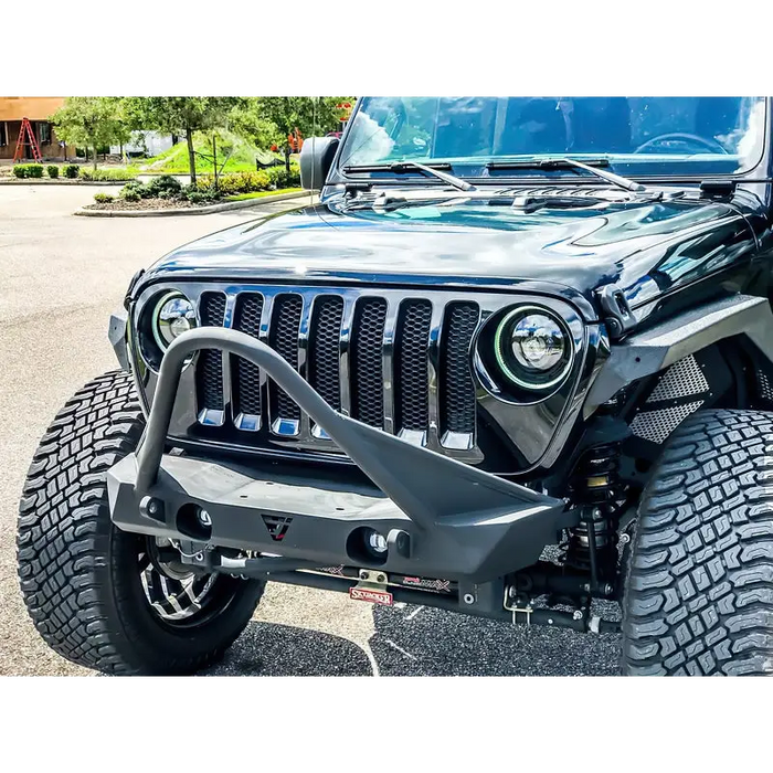 Close up of Jeep with large tire, Oracle Oculus Bi-LED Projector Headlights in Matte Black