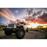 Oracle Oculus Bi-LED projector headlights for Jeep JL/Gladiator JT with sunset background