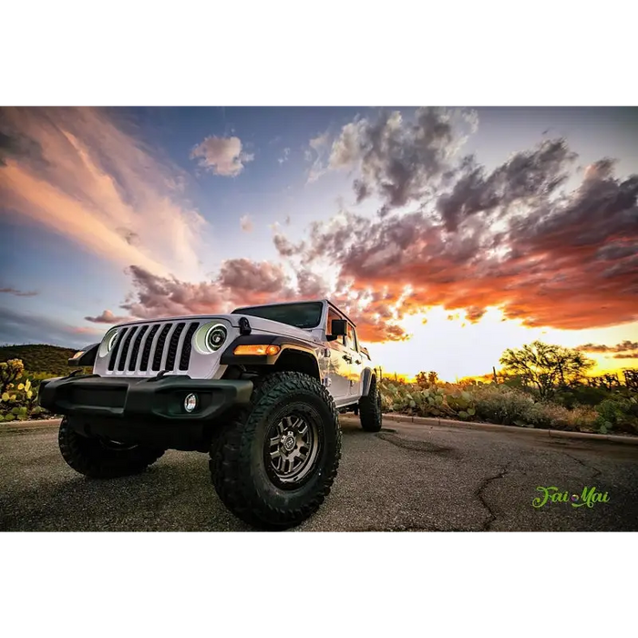 Oracle Oculus Bi-LED projector headlights for Jeep JL/Gladiator JT with sunset background