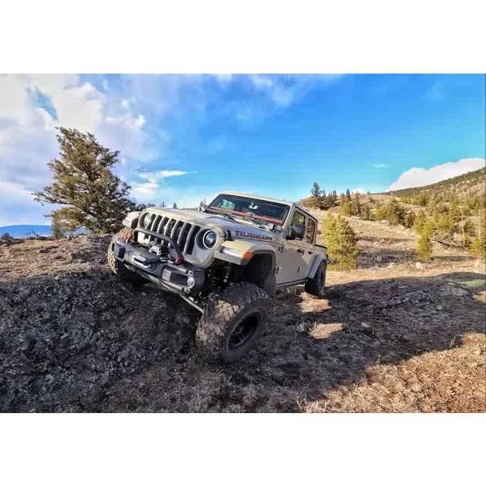 Off-road jeep driving on rocky trail - Oracle Oculus Bi-LED projector headlights for Jeep JL/Gladiator JT.