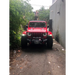 Red Jeep parked on road, Oracle Oculus Bi-LED projector headlights for Jeep JL/Gladiator JT - Matte Black