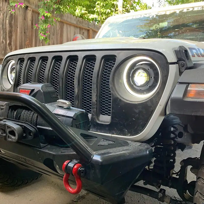 Oracle Oculus Bi-LED Projector Headlights for Jeep JL/Gladiator JT - Matte Black - 5500K featuring an arafed jeep with a red