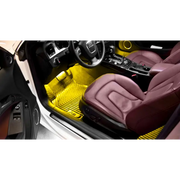 Interior of car with yellow carpeting shown in Oracle Pair 15in LED Strips Retail Pack - RGB ColorSHIFT.