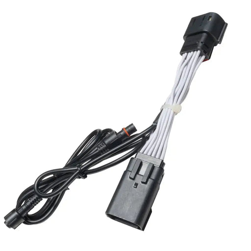 Black and white cable connected to a white cord for Oracle Plug & Play Wiring Adapter for Jeep Gladiator JT Reverse Lights.