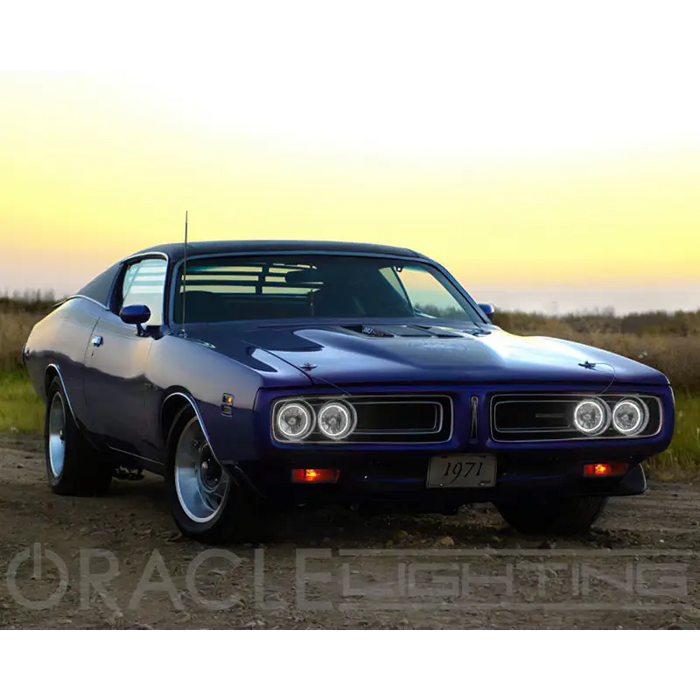 Blue 1970 Dodge Charger on dirt road with Oracle Pre-Installed Sealed Beam ColorSHIFT Halo