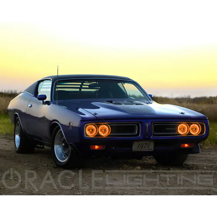 Blue 1970 Pontiac car parked on dirt road with Oracle Pre-Installed Sealed Beam ColorSHIFT Halo