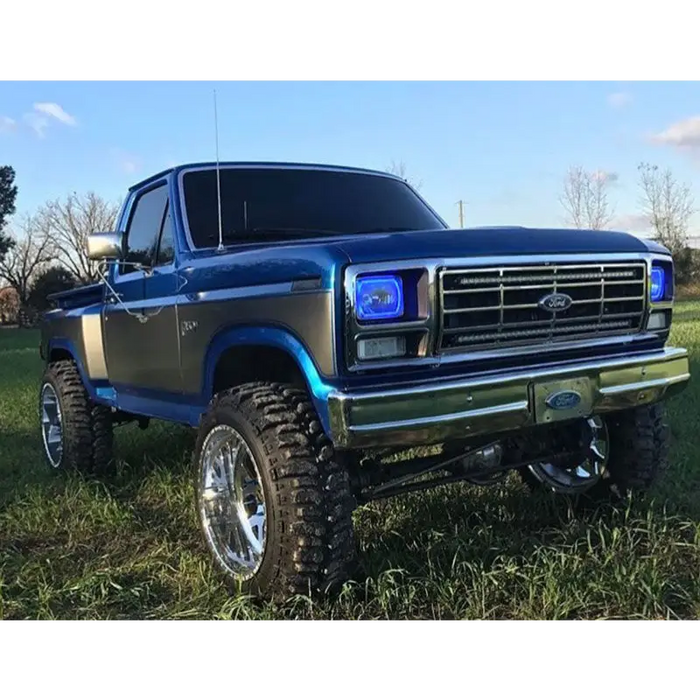 Blue truck parked in field with Oracle Pre-Installed Lights 7x6 IN. Sealed Beam - ColorSHIFT Halo.