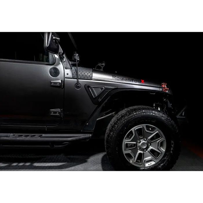 Black Jeep Wrangler JK parked in garage - Oracle Sidetrack LED System