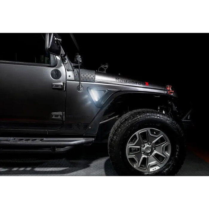 Black Jeep Wrangler JK with Oracle Sidetrack LED System and tire cover