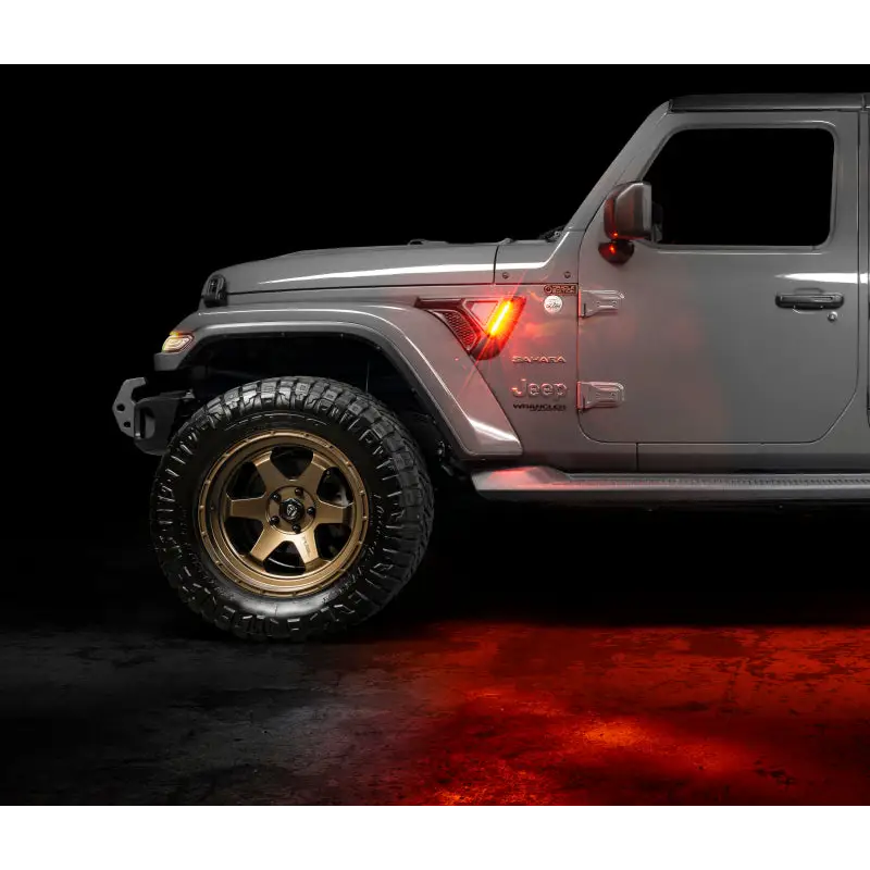 Oracle Sidetrack LED System for Jeep Wrangler JL/Gladiator JT - White Jeep with Gold Wheels on Black Background.