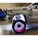 White truck with red wheels and rim illuminated by Oracle Underbody Wheel Well Rock Lights - White (4PCS) - 5000K