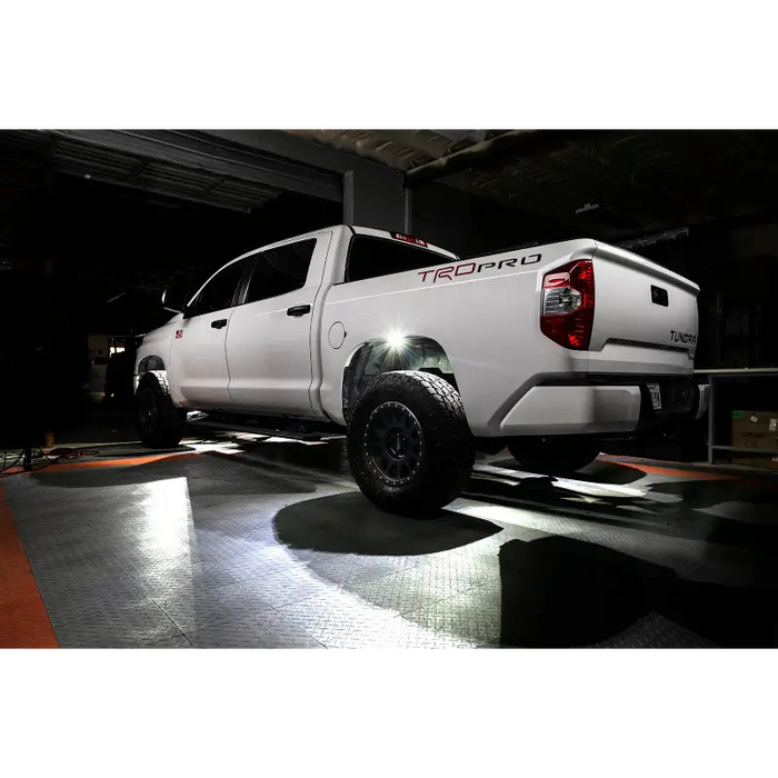 White rock lights on a truck parked in a garage