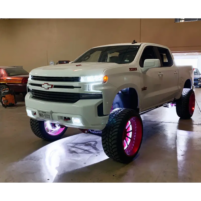 White rock lights on truck with red wheels and red rim for Oracle Underbody Wheel Well Rock Light Kit - 5000K