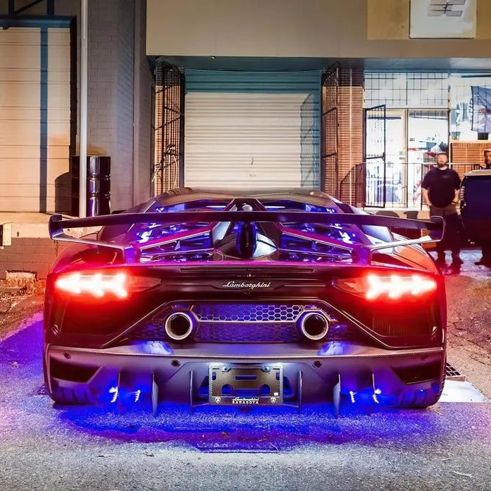 Dynamic ColorSHIFT LED underbody kit lights illuminating a car.