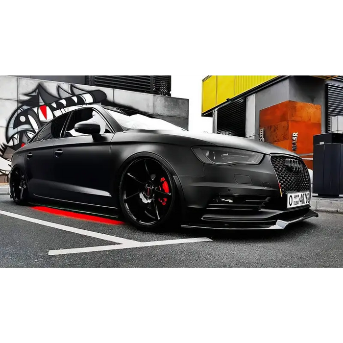 Black Audi with red wheels and white car under Oracle Universal Dynamic LED Underbody Kit - ColorSHIFT.