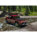 RetraxONE MX truck bed cover driving through river, perfect for Jeep Wrangler or Ford Bronco.