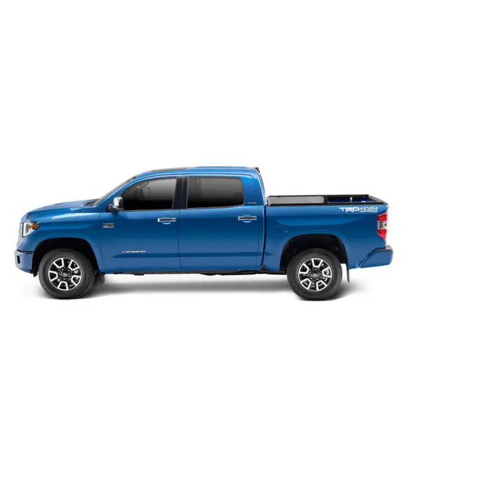 RetraxONE XR bed cover for 16-18 Tacoma with trax rail, showing blue truck on white background.