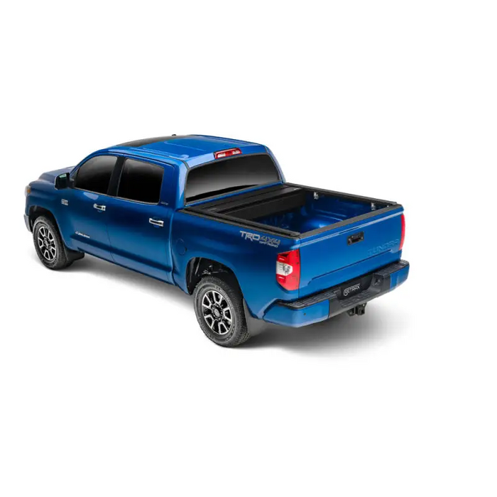 Blue truck with black bed cover - RetraxONE XR for 16-18 Tacoma, trax rail, cargo capacity