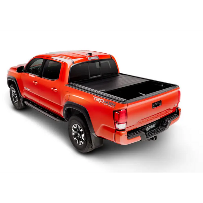 Red truck with black bed cover - RetraxPro MX for 16-18 Tacoma Double Cab