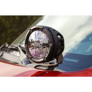 Close up of motorcycle headlight on red car, toyota 4runner a-pillar mount installation instructions