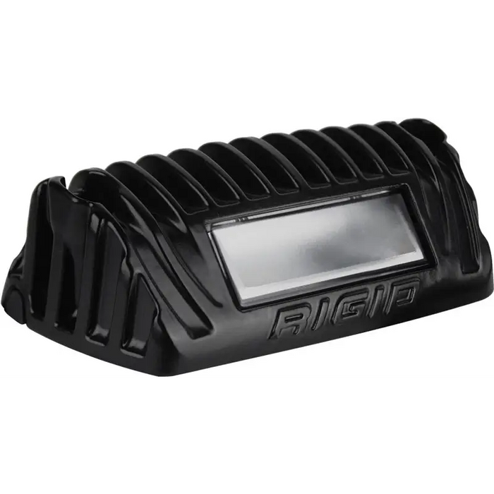 Black motorcycle helmet with attached light displayed in Rigid Industries 1x2 scene light.