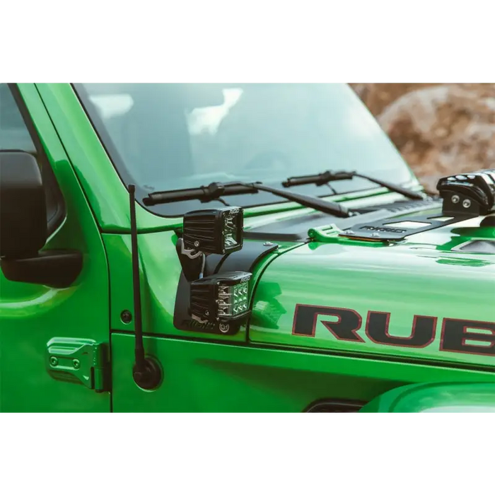 Green Jeep with black roof rack - featured in Rigid Industries 2018 Jeep JL Cowl Mount Tall Extension Arm Kit.