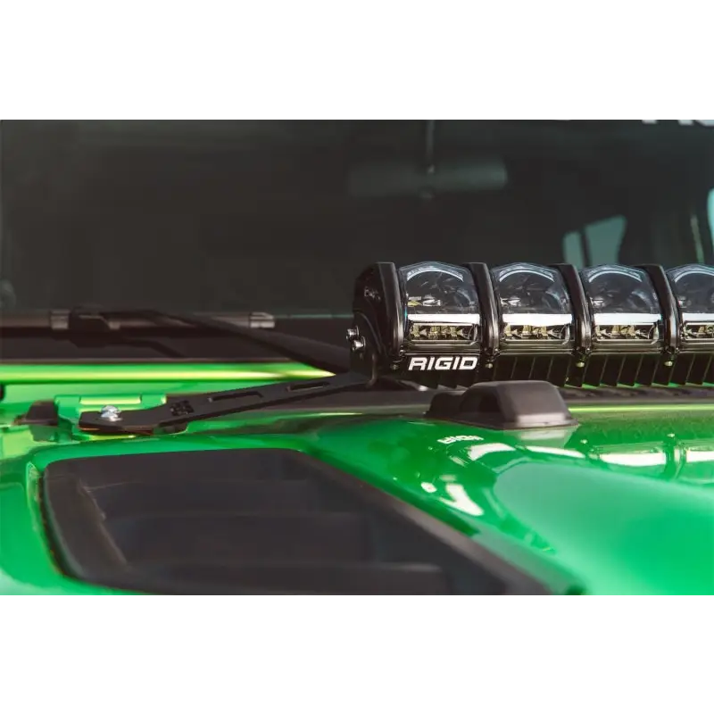 Green car with four lights on hood mount kit for jeep jl - rigid industries 2018.