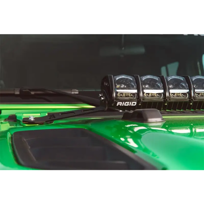 Green car with four lights on hood mount kit for jeep jl - rigid industries 2018.