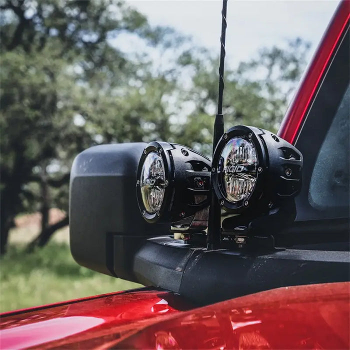 Rigid Industries Ford Bronco Dual Pod A-Pillar Mount Kit with two lights on red truck