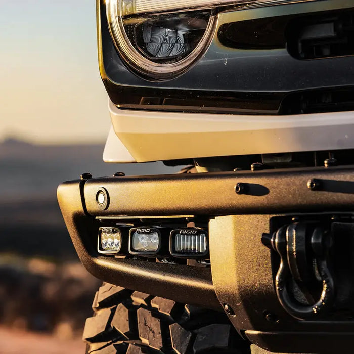 Front bumper of a jeep with light on suitable for Rigid Industries 2021+ Ford Mod Bumper Fog Mounts.