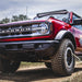 Rigid Industries 360-Series PRO SAE Fog Light Kit with red truck parked on dirt road