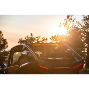 Rear facing car light bar with sun shining behind it