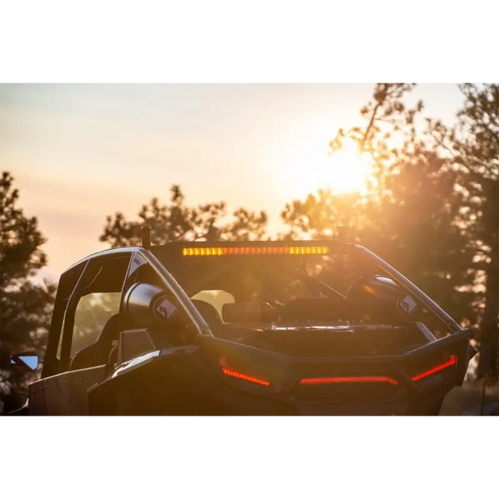 Rear facing car light bar with sun shining behind it