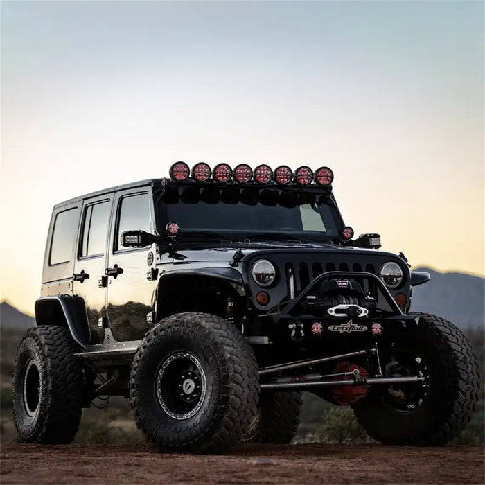 Rigid industries 360-series 4in light covers - black pair with people on top of jeep